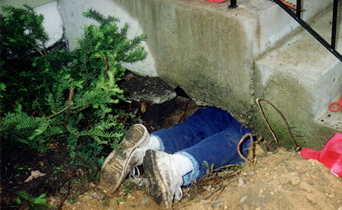 Brad under a porch after raccoon